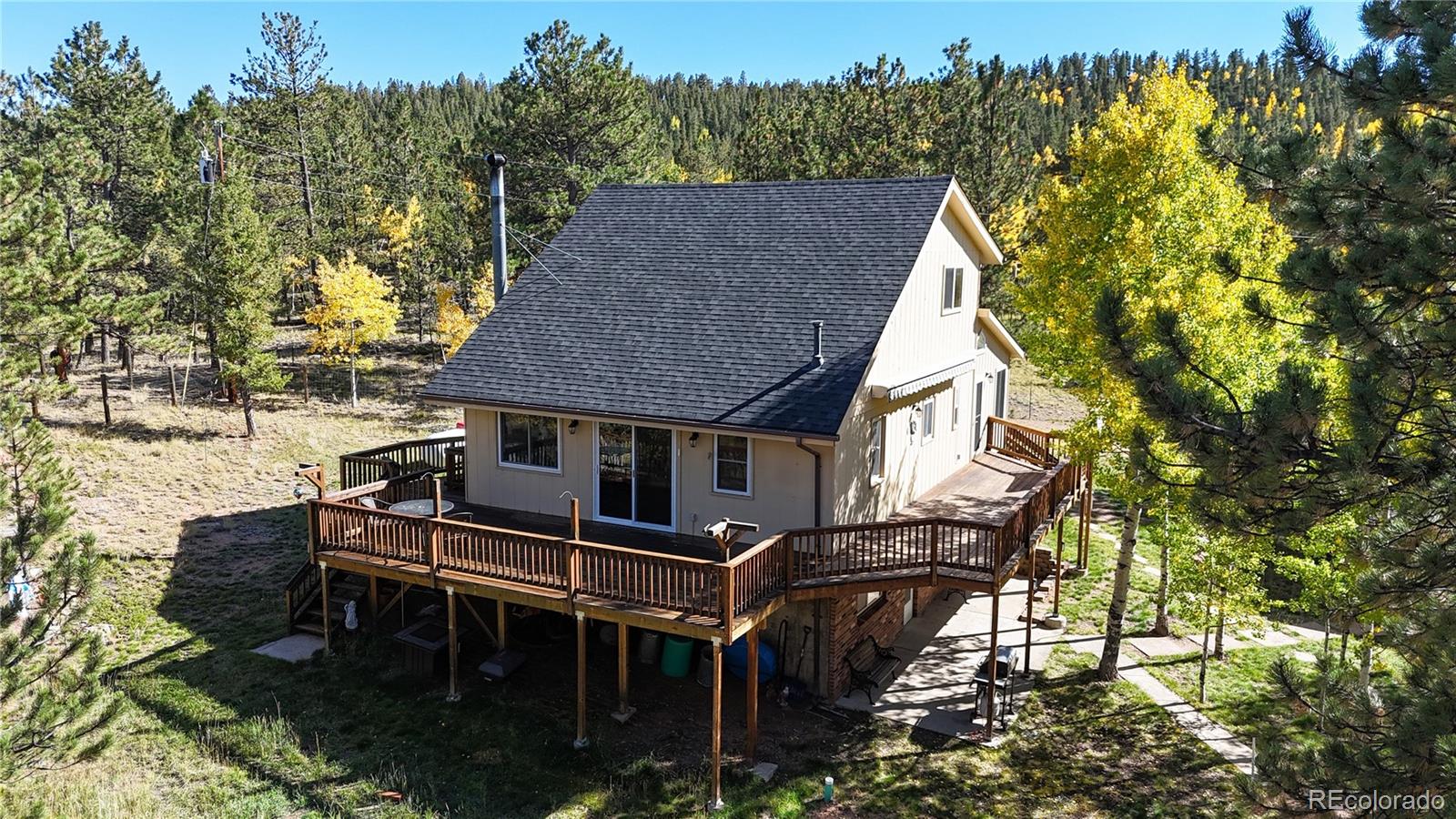 92 Four Bits Street Bailey, CO 80421 - Photo 41 of 50 a aerial view of a house with a fountain back yard