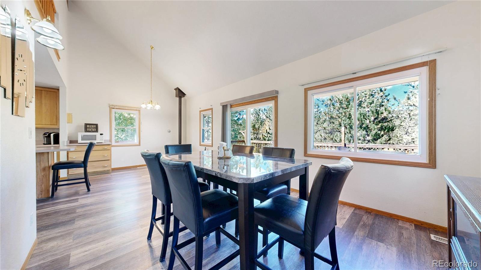 92 Four Bits Street Bailey, CO 80421 - Photo 5 of 50 a view of a dining room with furniture and wooden floor