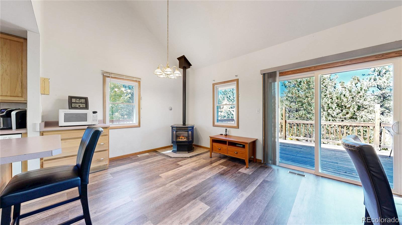 92 Four Bits Street Bailey, CO 80421 - Photo 6 of 50 a view of a livingroom with furniture window and wooden floor