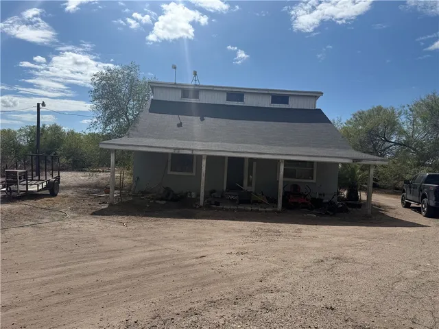 a view of house with outdoor space and sitting space