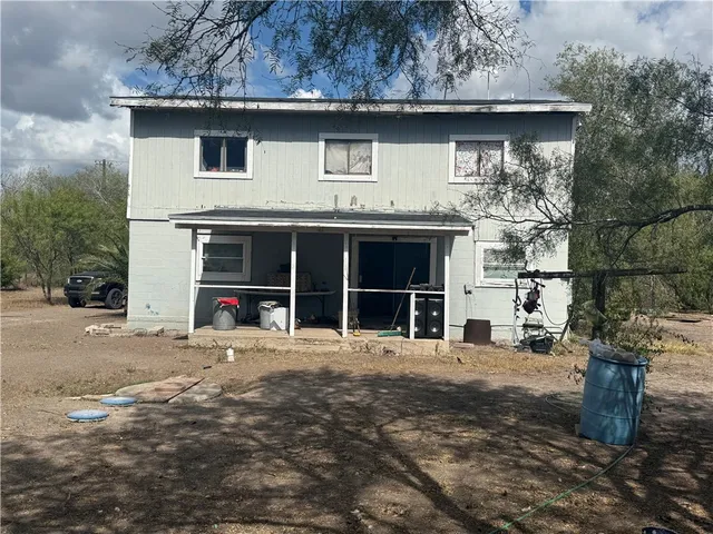 a house with trees in the background