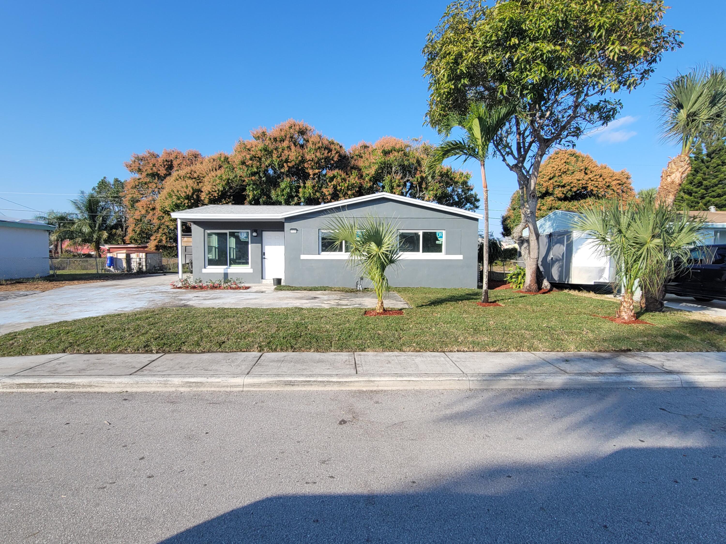 1122 West 26th Court Riviera Beach, FL 33404 - Photo 1 of 13 House Front