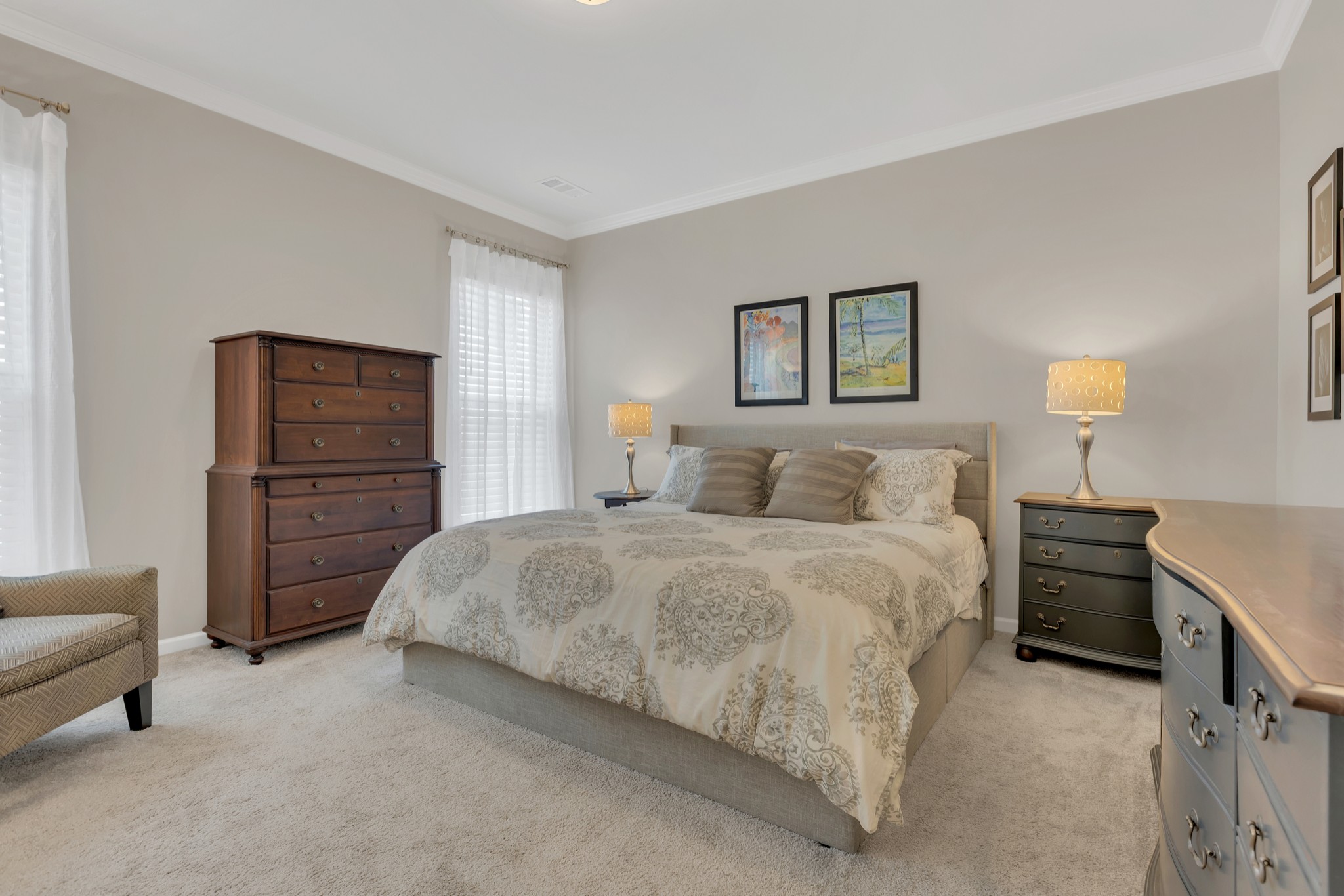 1224 Del Webb Boulevard Spring Hill, TN 37174 - Photo 18 of 47 a spacious bedroom with a bed and a couch