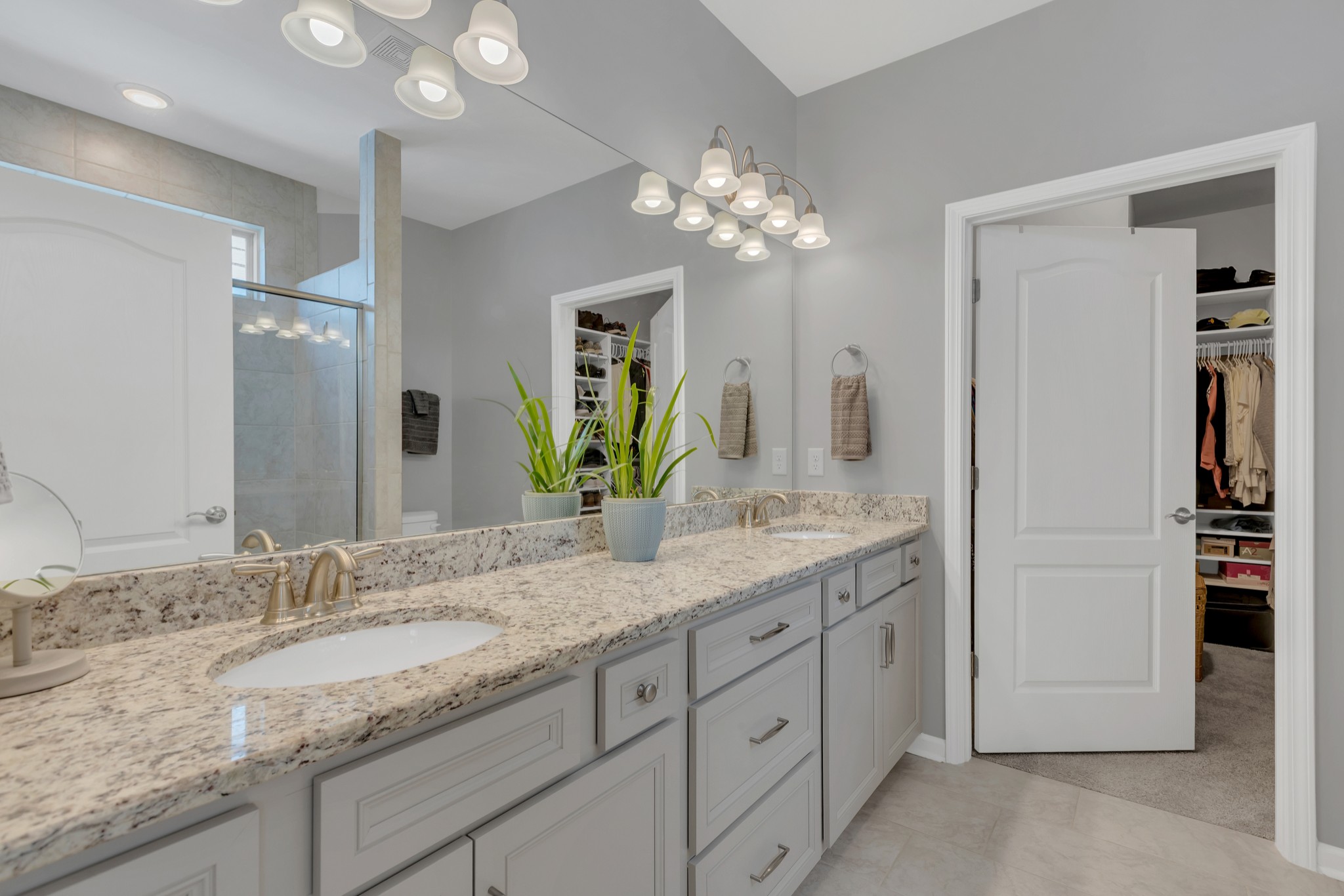 1224 Del Webb Boulevard Spring Hill, TN 37174 - Photo 19 of 47 a bathroom with a granite countertop double vanity sink and a mirror