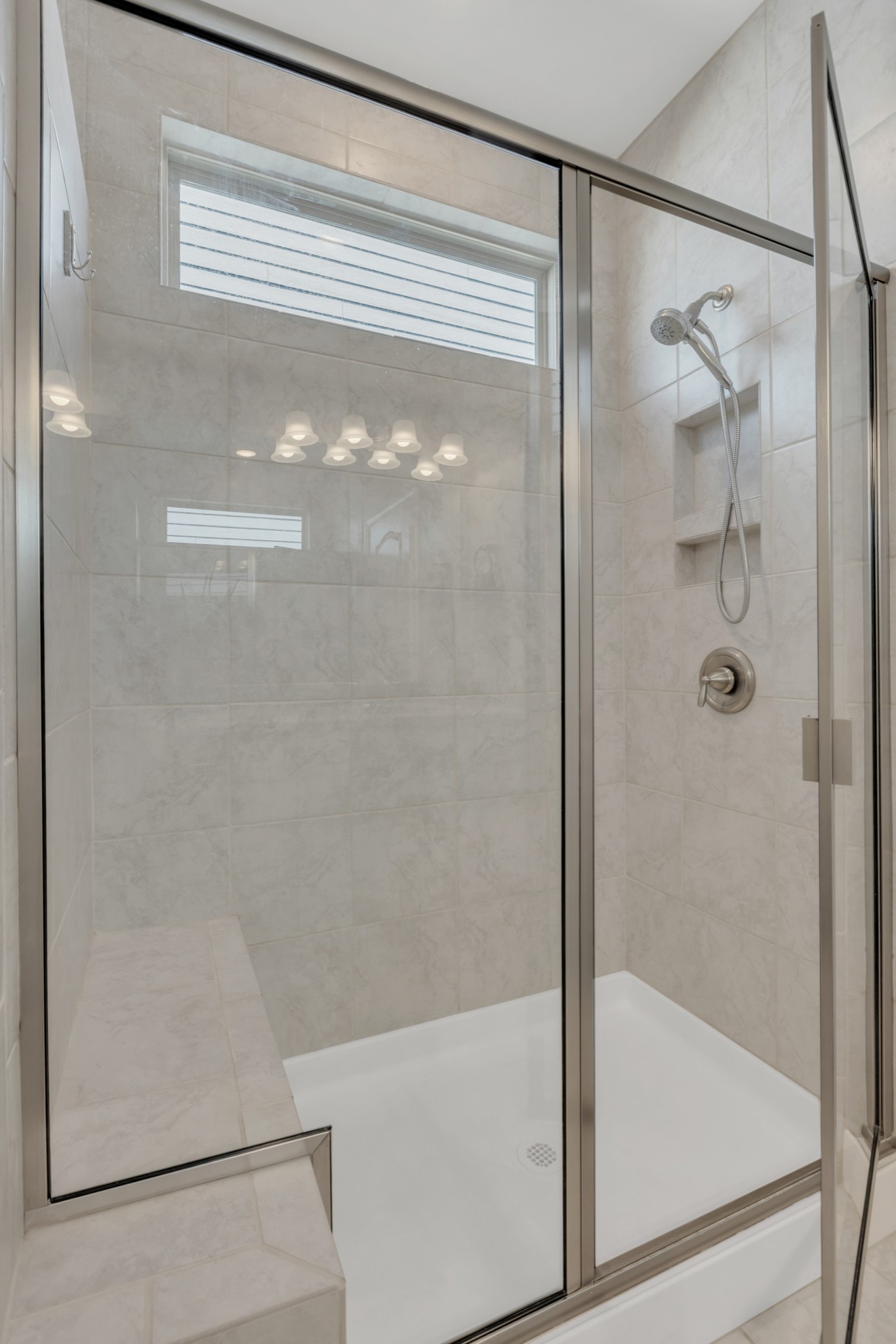 1224 Del Webb Boulevard Spring Hill, TN 37174 - Photo 20 of 47 a bathroom with a glass shower door