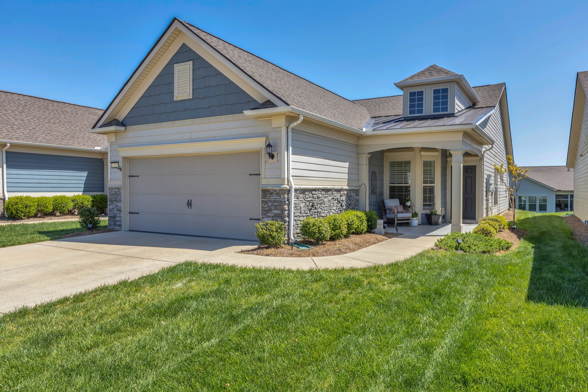 1224 Del Webb Boulevard Spring Hill, TN 37174 - Photo 2 of 47 a front view of a house with a yard and garage