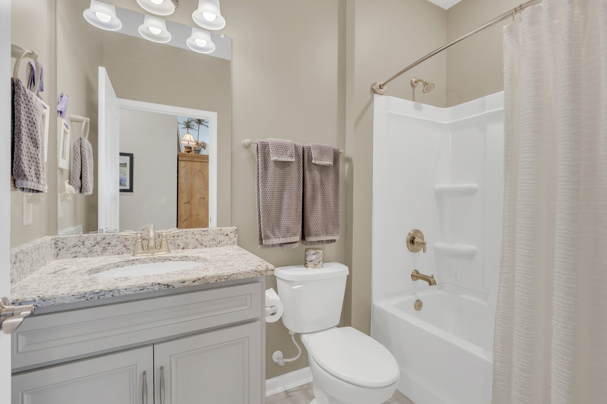 1224 Del Webb Boulevard Spring Hill, TN 37174 - Photo 23 of 47 a bathroom with a granite countertop sink toilet and shower