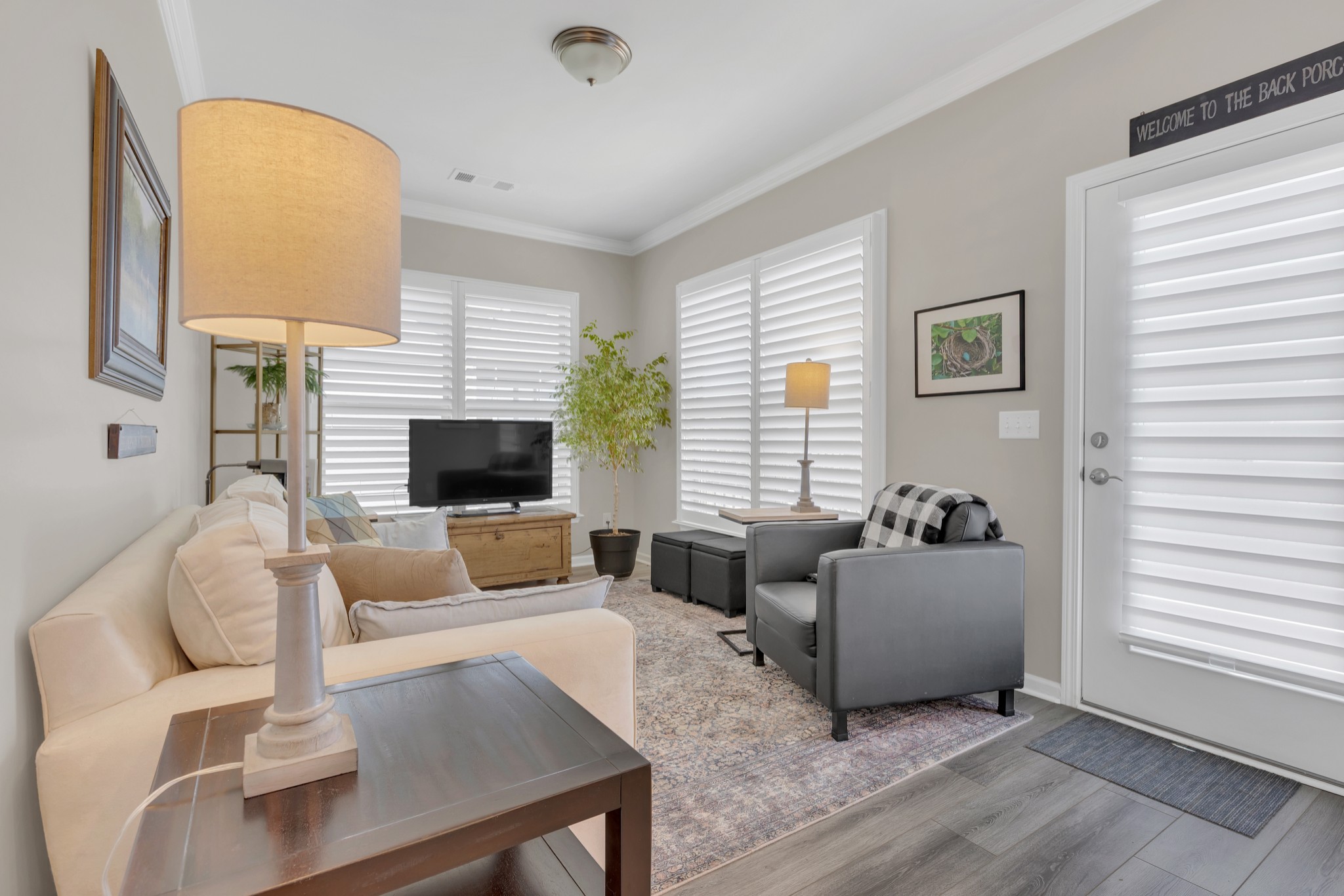 1224 Del Webb Boulevard Spring Hill, TN 37174 - Photo 25 of 47 a living room with furniture fireplace and a flat screen tv