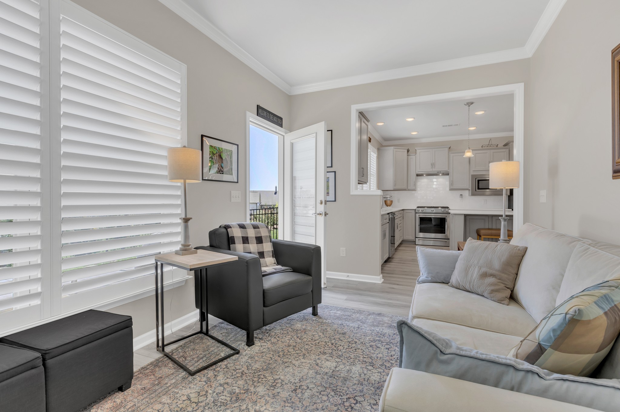 1224 Del Webb Boulevard Spring Hill, TN 37174 - Photo 26 of 47 a living room with furniture and a view of kitchen