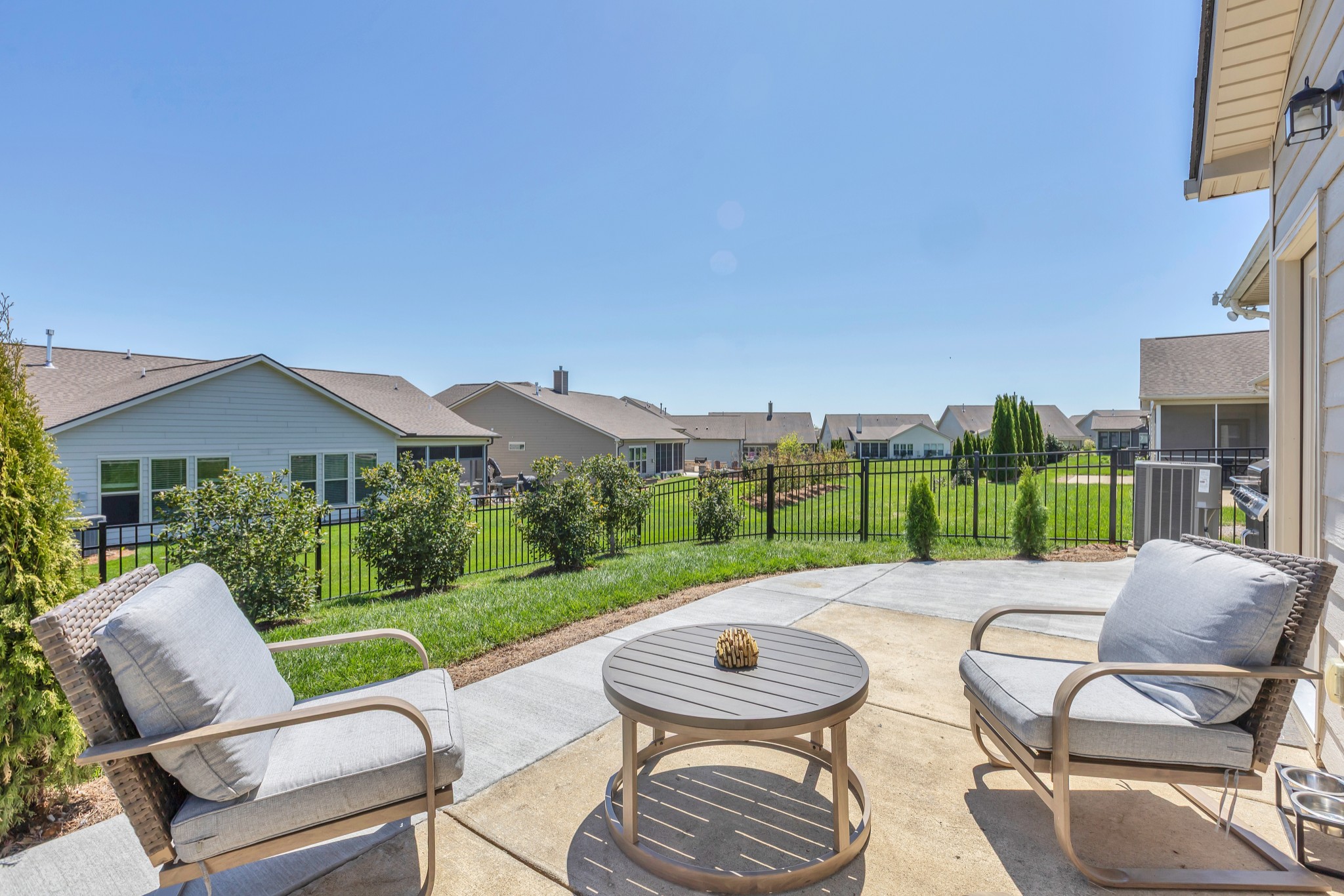 1224 Del Webb Boulevard Spring Hill, TN 37174 - Photo 28 of 47 a view of a patio with a table chairs and a backyard