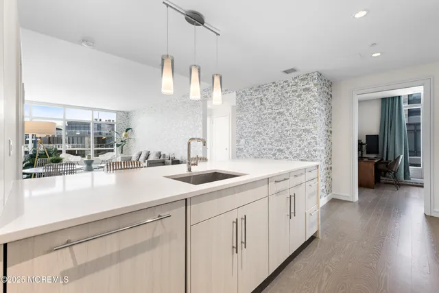 a kitchen with a sink and cabinets