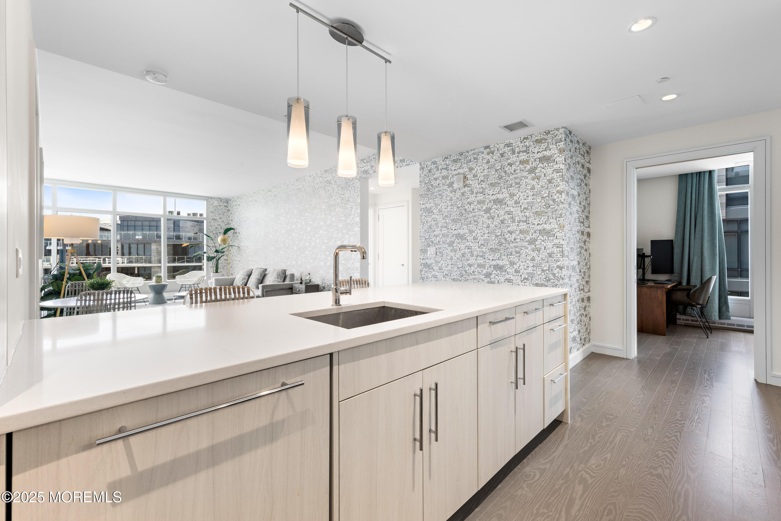 20 Melrose Terrace, Unit 511 Long Branch, NJ 07740 - Photo 12 of 35 a kitchen with a sink and cabinets