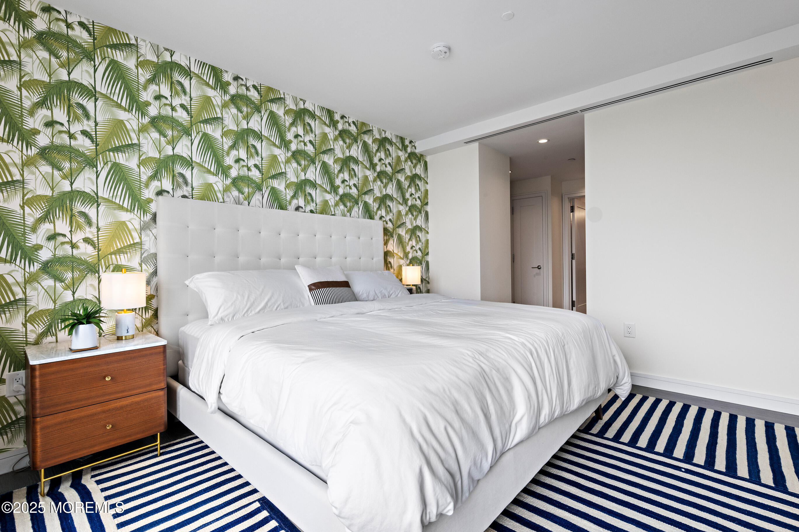 20 Melrose Terrace, Unit 511 Long Branch, NJ 07740 - Photo 14 of 35 a bedroom with a bed and a window