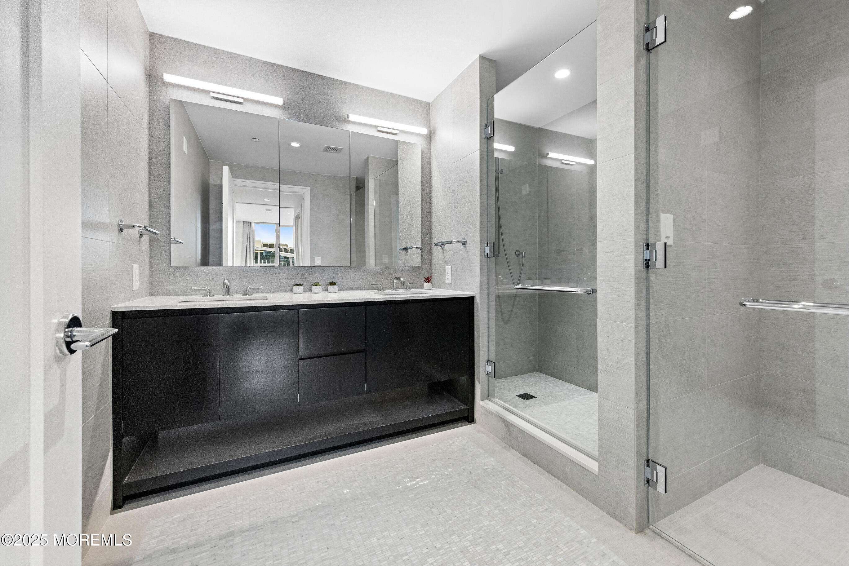 20 Melrose Terrace, Unit 511 Long Branch, NJ 07740 - Photo 15 of 35 a bathroom with a sink a toilet and shower