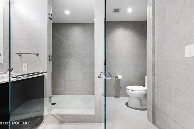 a bathroom with a toilet a sink and bathtub