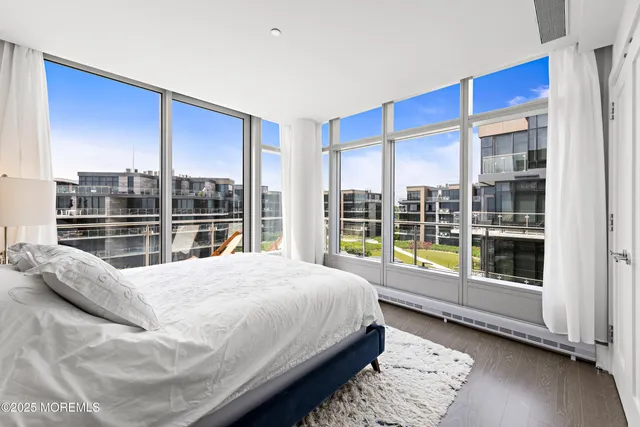 a large bed sitting in front of a window