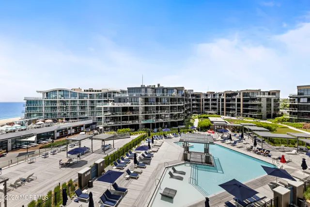 a view of city from balcony with outdoor seating