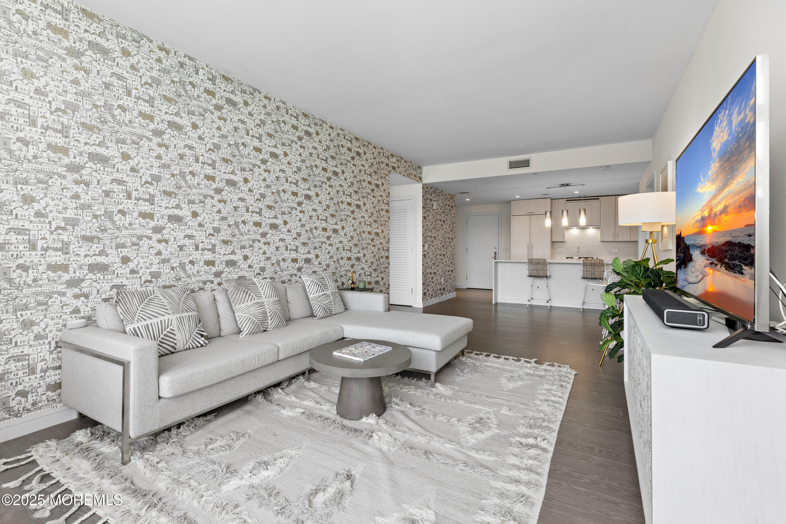 20 Melrose Terrace, Unit 511 Long Branch, NJ 07740 - Photo 5 of 35 a living room with furniture and a flat screen tv