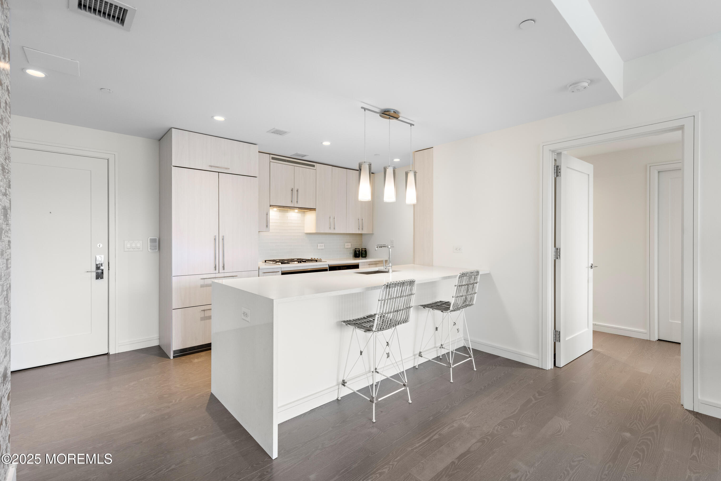 20 Melrose Terrace, Unit 511 Long Branch, NJ 07740 - Photo 7 of 35 a kitchen with a stove a refrigerator and a sink