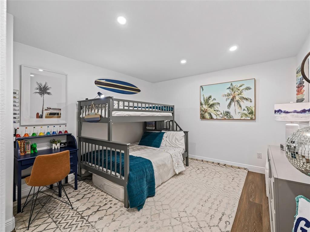 12943 Southeast Sunset Harbor Road Weirsdale, FL 32195 - Photo 67 of 87 a bedroom with furniture and a window