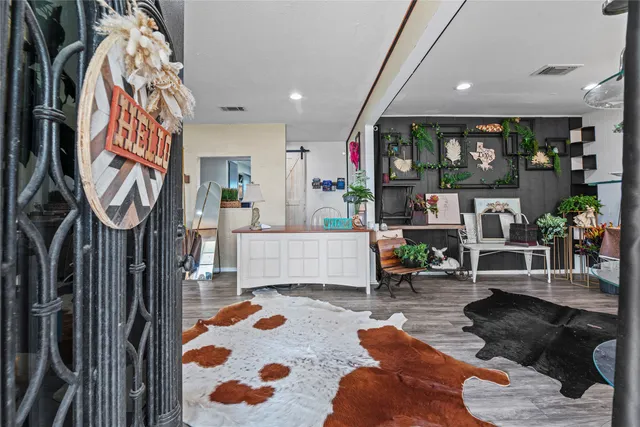 a living room with furniture and entryway