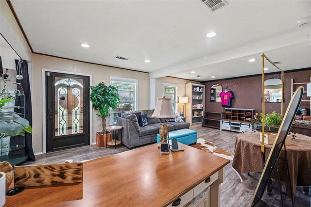 a living room with fireplace furniture and a flat screen tv