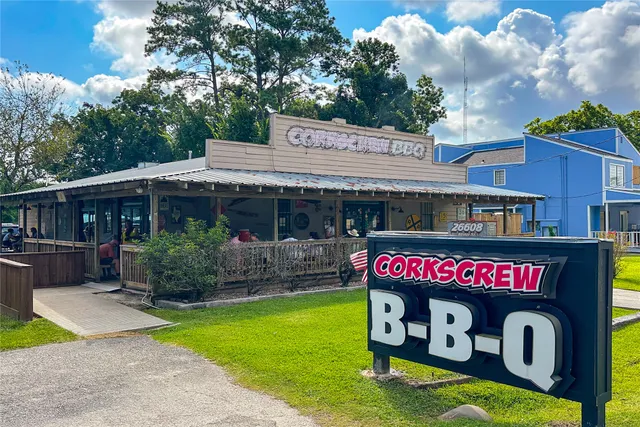 a front view of a house with a yard table and chairs