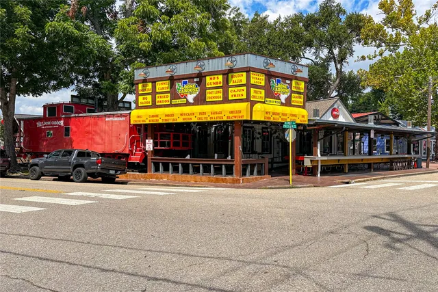 a front view of house with yard and swimming pool