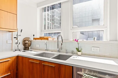 a kitchen with a sink and a window