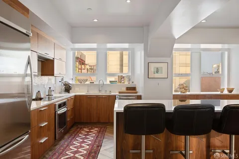 a kitchen with a sink cabinets and appliances