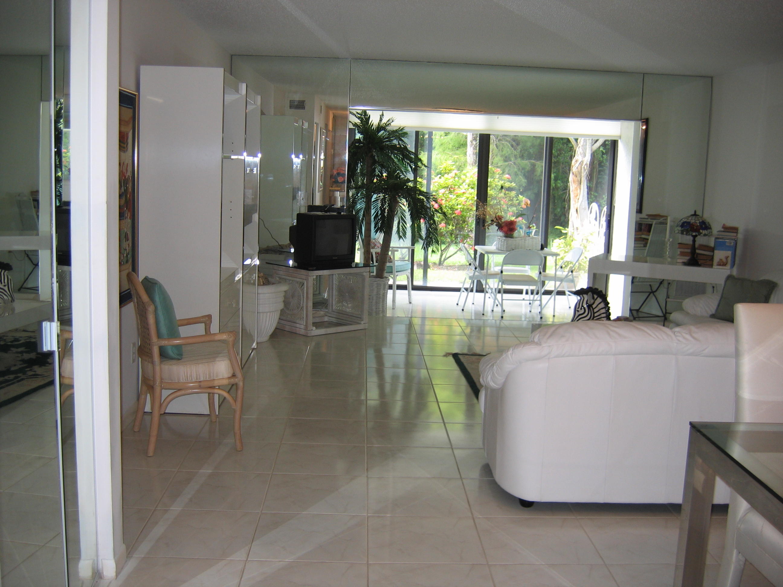 21946 Arriba Real, Unit 2C Boca Raton, FL 33433 - Photo 7 of 43 Living Room-Patio