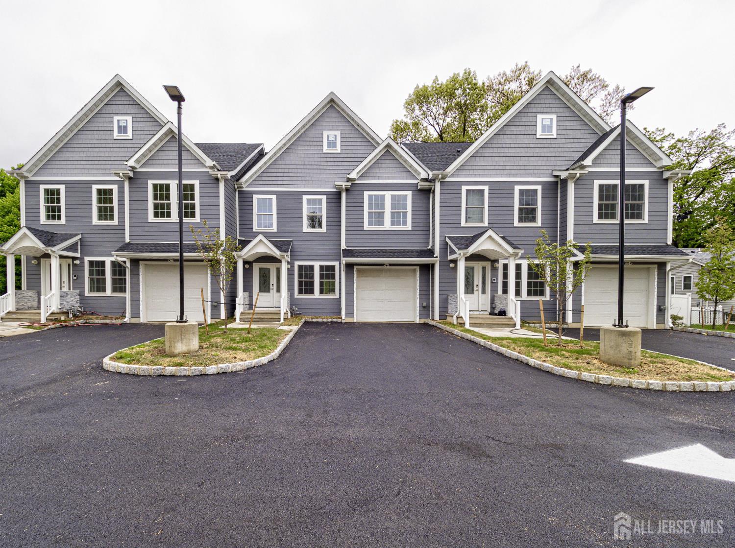 8 Travers Avenue, Unit 1 Edison, NJ 08817 - Photo 2 of 19 a front view of a house with a garden