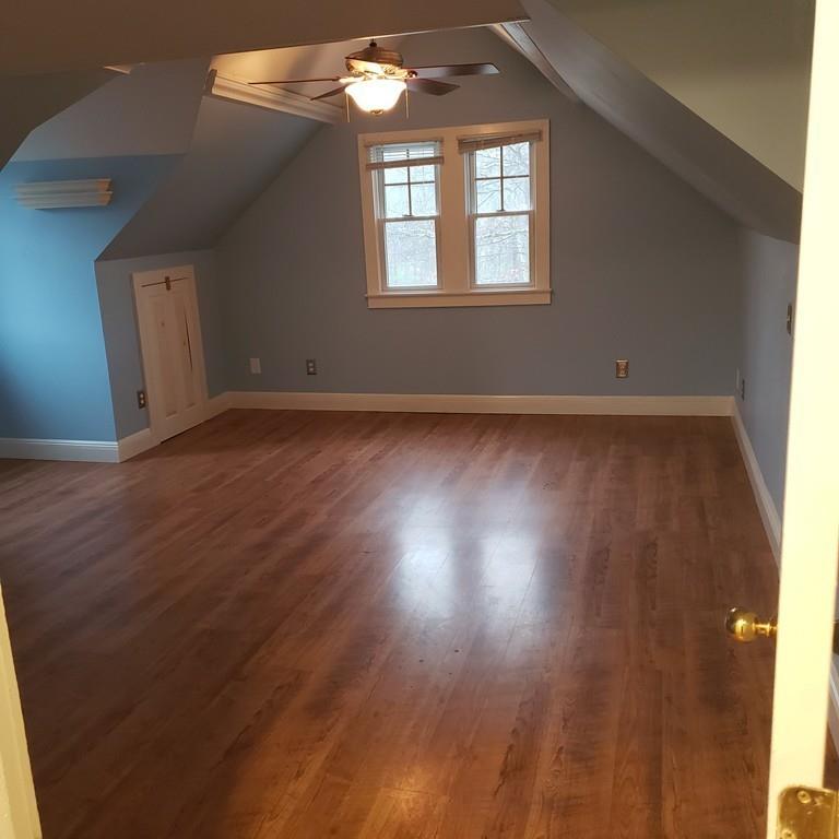 102 Mason Road Dudley, MA 01571 - Photo 16 of 29 an empty room with wooden floor and windows