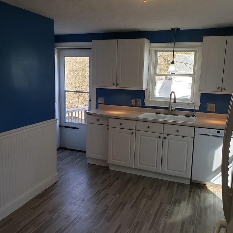 102 Mason Road Dudley, MA 01571 - Photo 6 of 29 a kitchen with a sink wooden floor and window