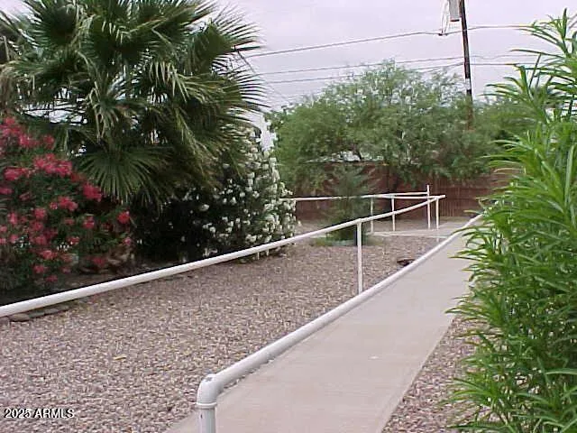 a view of a balcony with plants