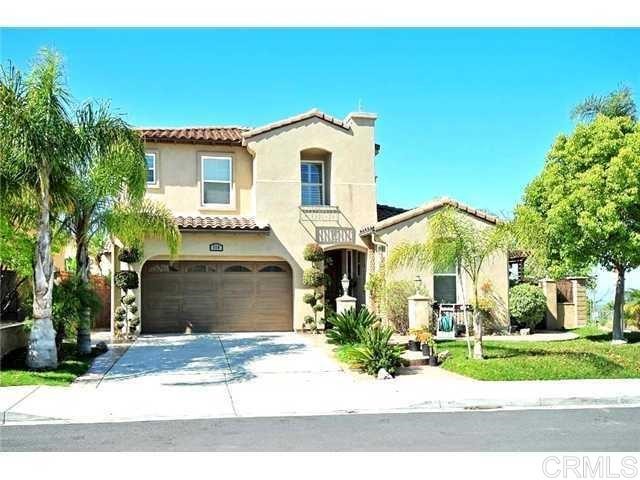 310 Corte Goleta Chula Vista, CA 91914 - Photo 1 of 6 a view of a white house with a yard and potted plants