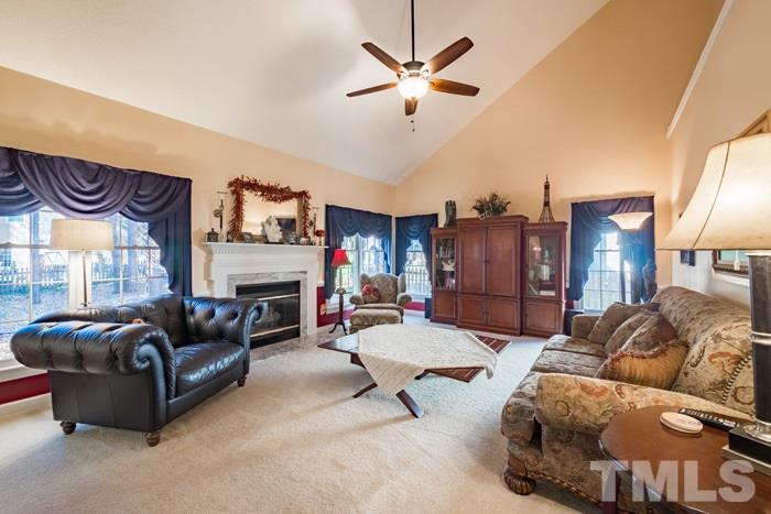 5624 Barham Court Raleigh, NC 27613 - Photo 2 of 19 a living room with furniture and a fireplace