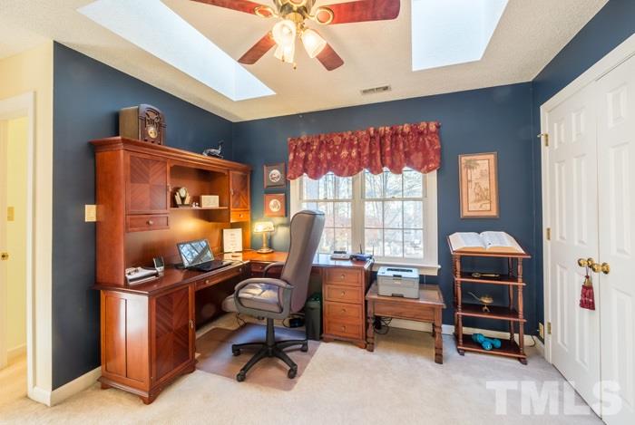 5624 Barham Court Raleigh, NC 27613 - Photo 14 of 19 a view of a workspace with furniture and a window