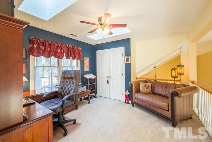 5624 Barham Court Raleigh, NC 27613 - Photo 15 of 19 a living room with furniture and a window