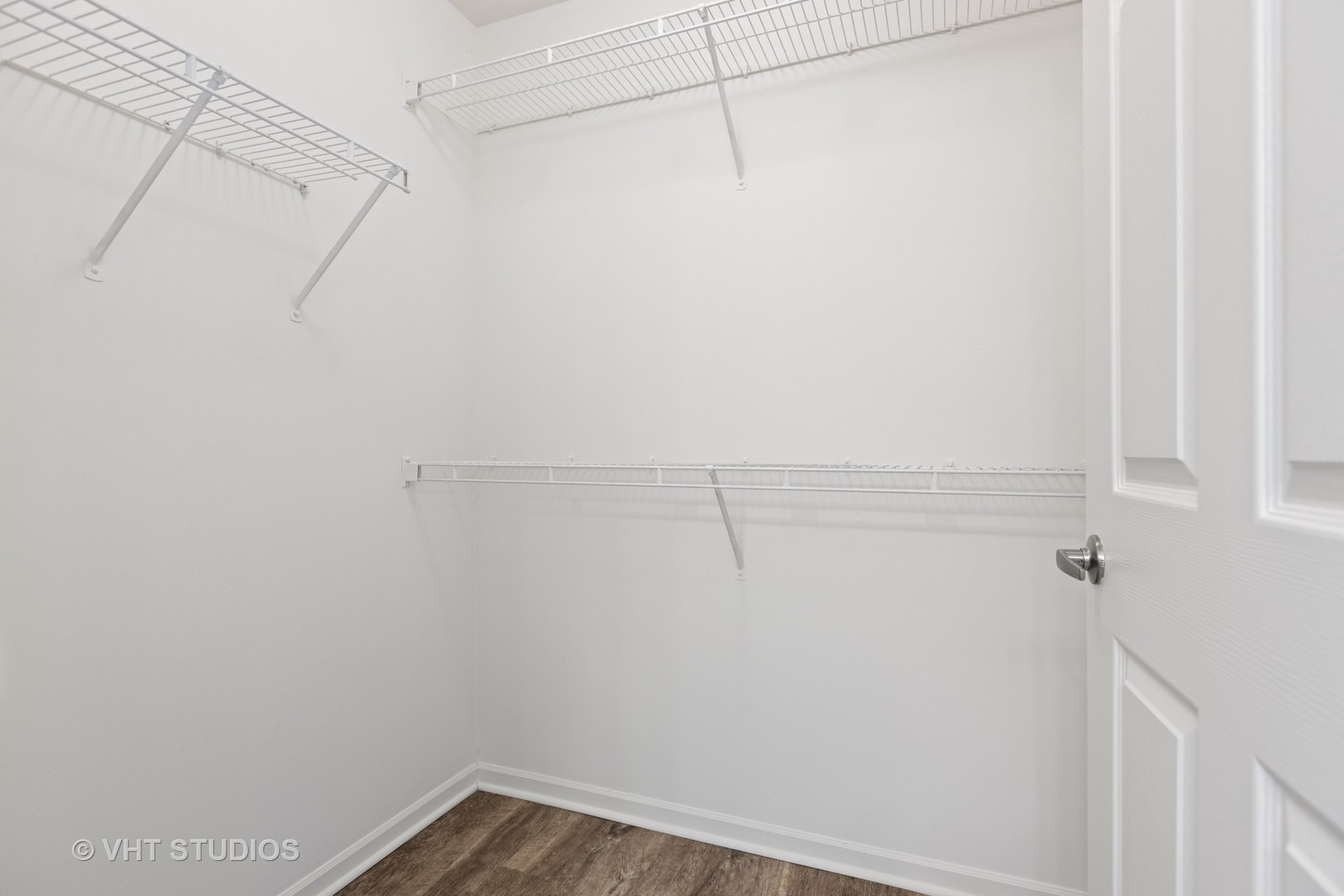 136 Beethoven Court, Unit 136 Wheaton, IL 60189 - Photo 17 of 61 a view of a room with racks on the wall