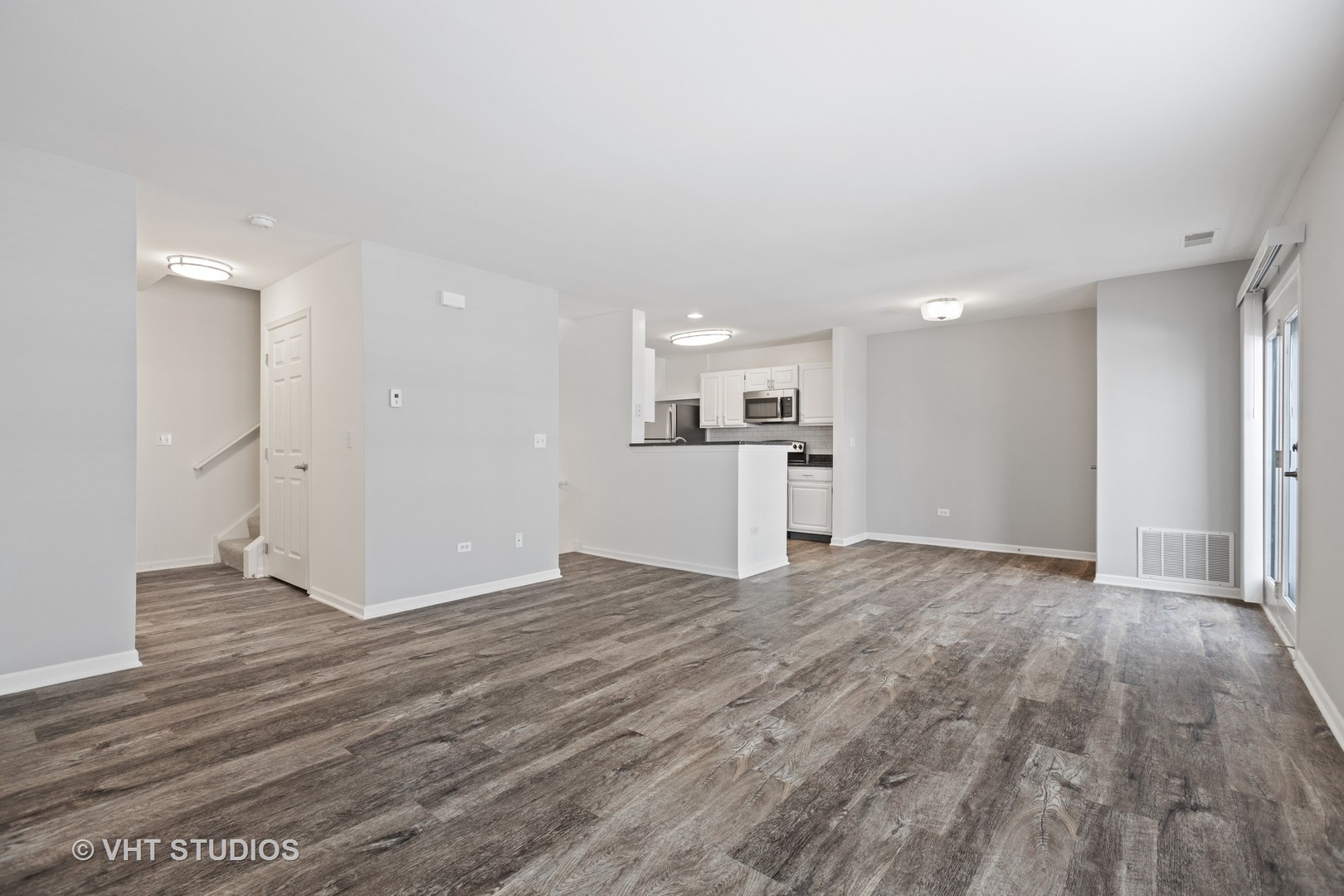 136 Beethoven Court, Unit 136 Wheaton, IL 60189 - Photo 4 of 61 a view of a kitchen with a sink and a refrigerator