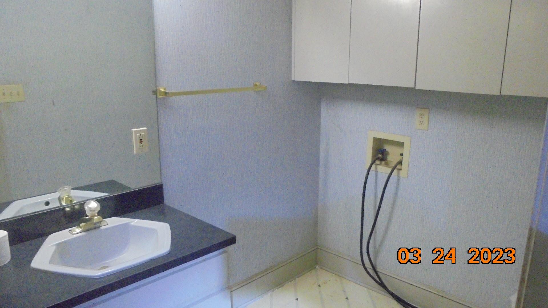 6614 Medlin Road Monroe, NC 28112 - Photo 12 of 14 a bathroom with a sink and a mirror