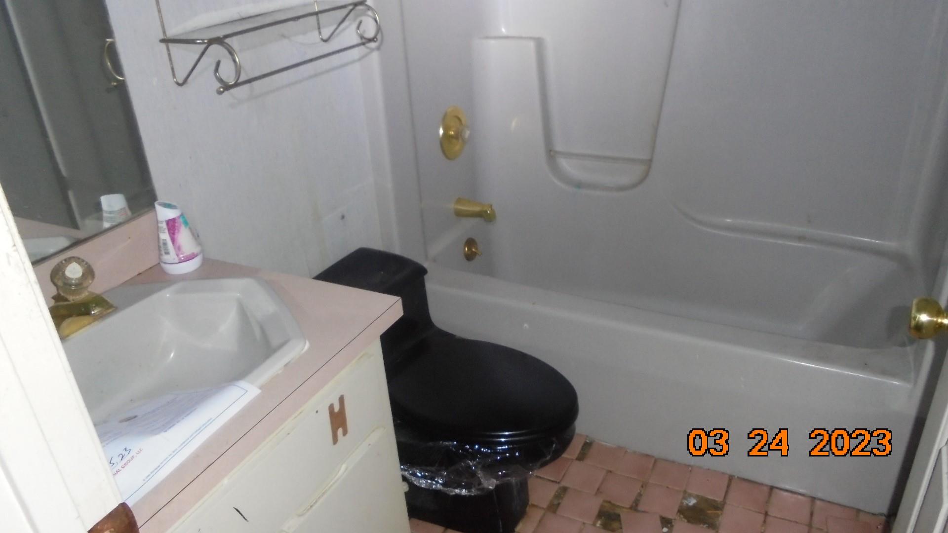 6614 Medlin Road Monroe, NC 28112 - Photo 14 of 14 a bathroom with a granite countertop sink a toilet and bathtub