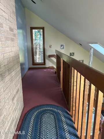 a view of a hallway with windows