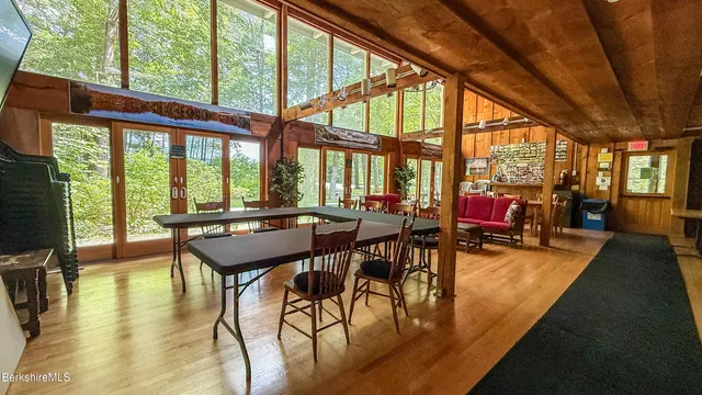 a view of a dining room with furniture window and outside view