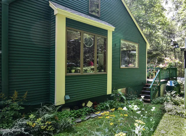 a view of a house that has a small garden
