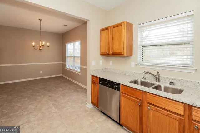 a kitchen with a sink and a window