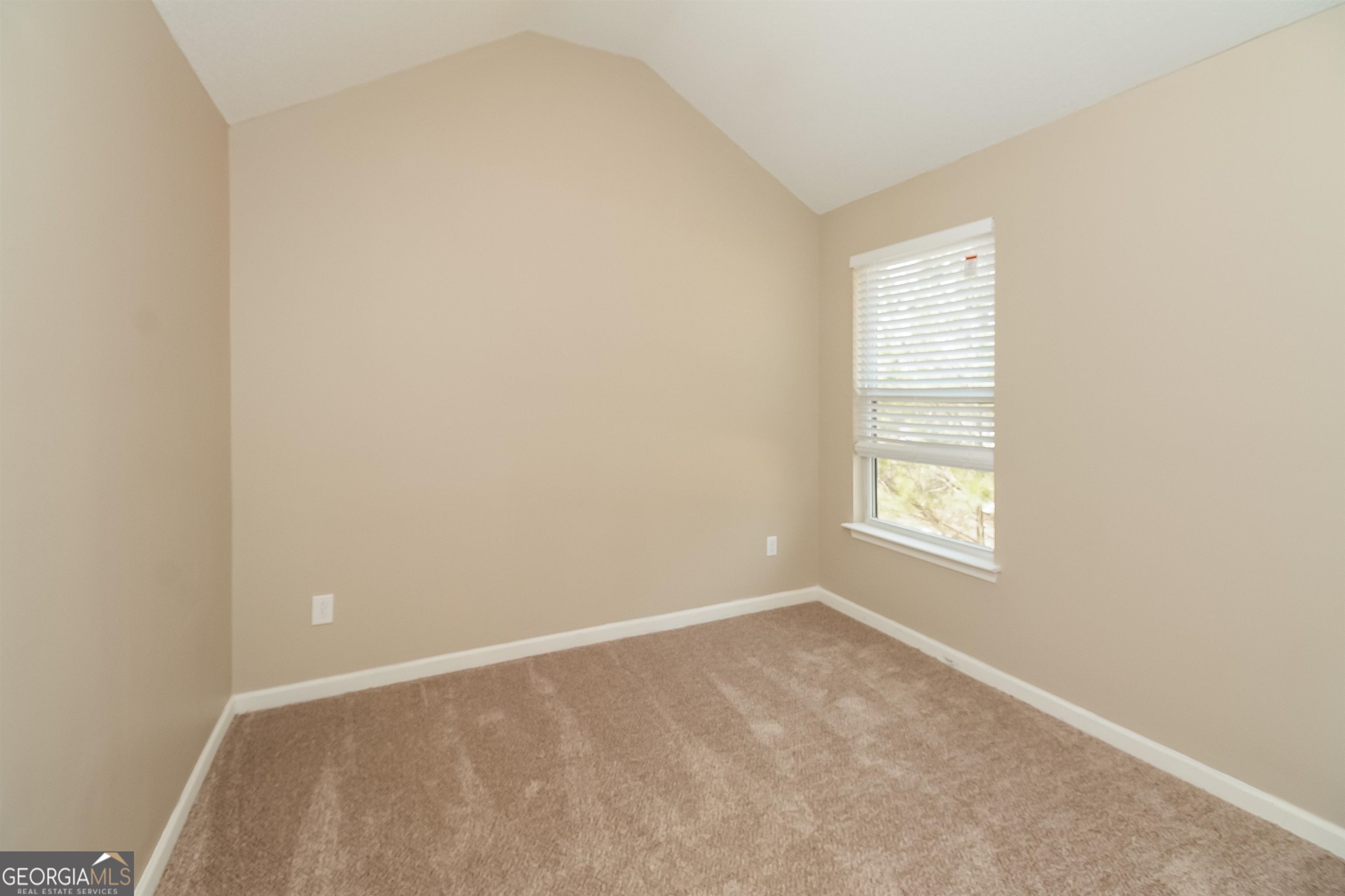 2413 Hackamore Drive Atlanta, GA 30349 - Photo 3 of 15 an empty room with a window