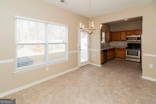 a view of a kitchen with a sink and a stove top oven