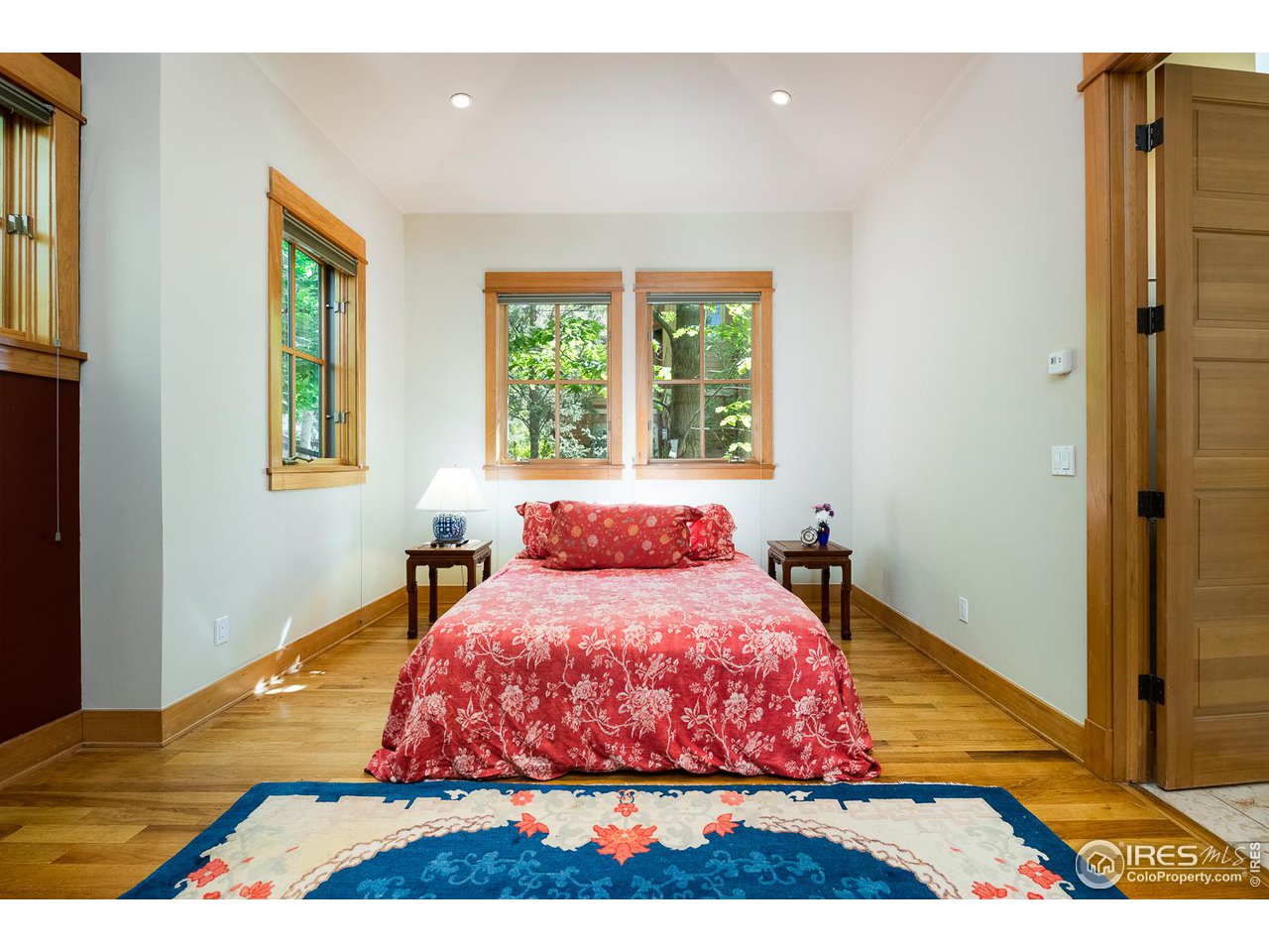 520 Spruce Street Boulder, CO 80302 - Photo 18 of 40 a bed sitting in a bedroom next to a window
